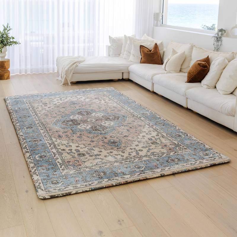 Living room with a muscle mat rug and white sofa